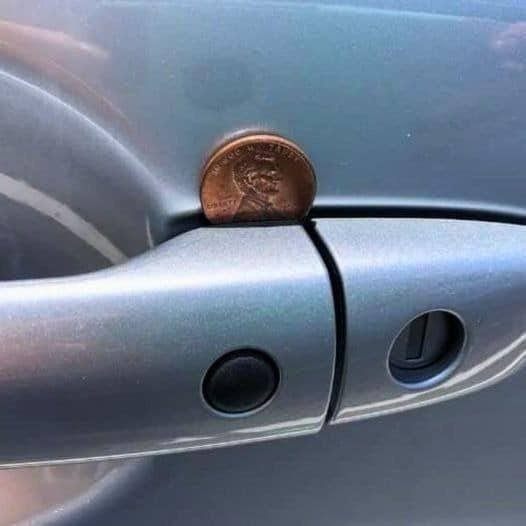 Left my car in parking lot today. When I got back, I saw a penny lodged in passenger’s door handle. Seemed strange. What does it mean?