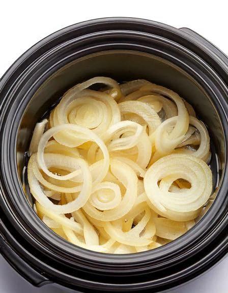 Put raw sliced onions in a slow cooker with these 2 ingredients. Dinner doesn’t get easier..